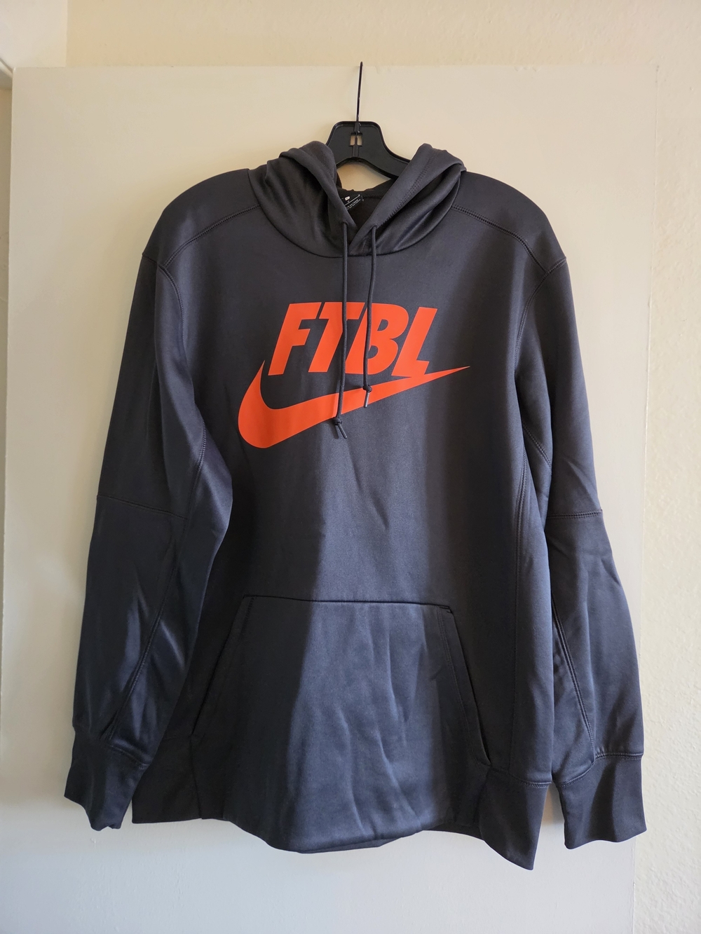 Nike Men's Black Zip-Up Hoodie with Orange FTBL Swoosh